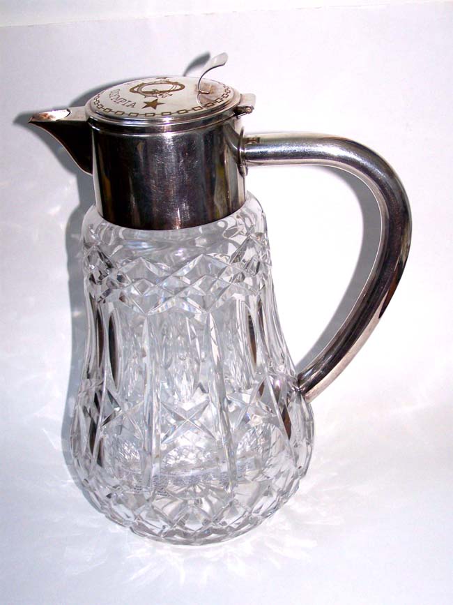 A Silver mounted water pitcher owned and used by Admiral George Dewey aboard his flagship USS Olympia along with a photo dated 1903 and note. Illustrated in JACK TAR, A Sailor's Life 1750-1910, p.279.
